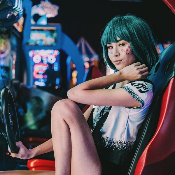 Cosplayers in detailed handmade anime and pop-culture costumes at a cosplay convention