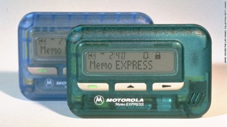 Vintage 1990s alphanumeric pager (beeper) device with a small text screen, a once-ubiquitous retro communication gadget