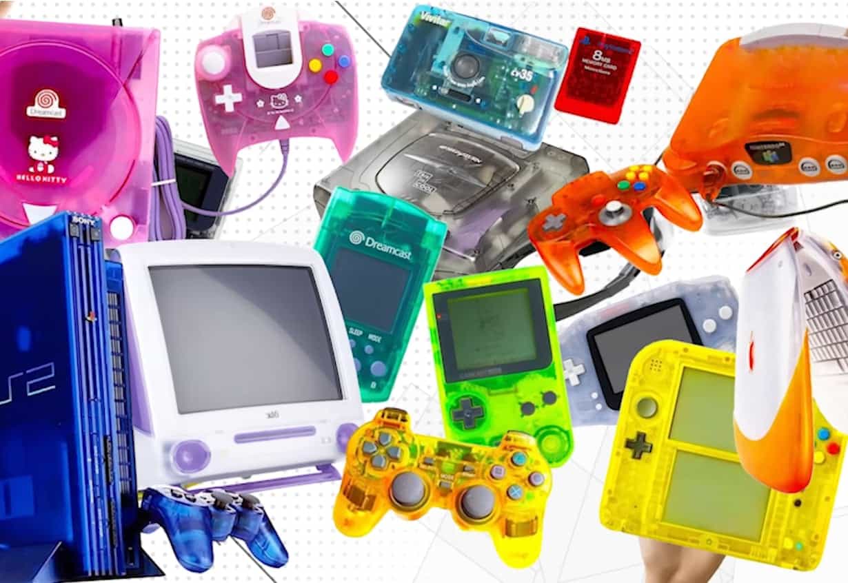 A collection of clear see-through 90s electronics including transparent Game Boys and pagers showing their inner components