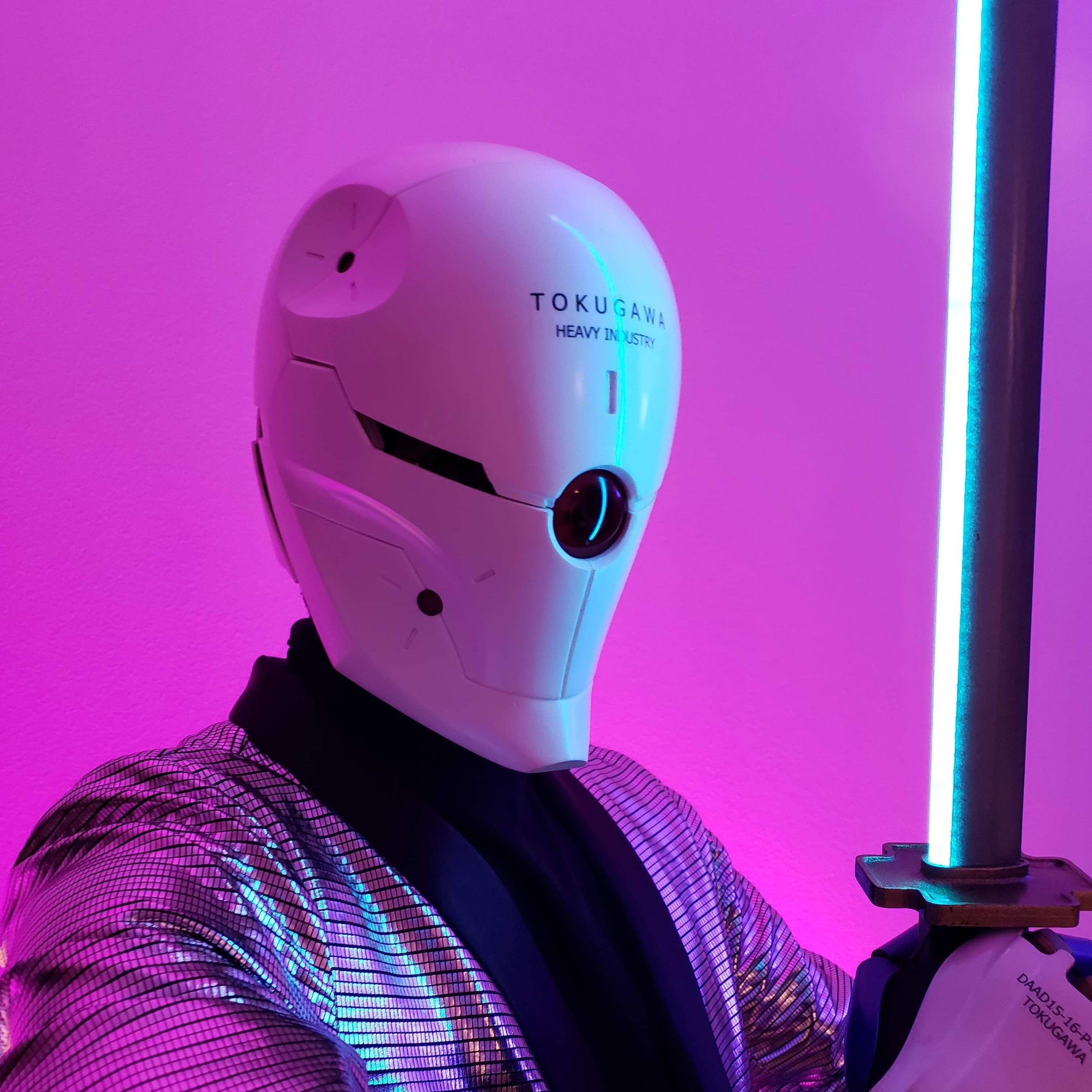 Cosplayer Diegator wearing his detailed motorized Gray Fox helmet costume build